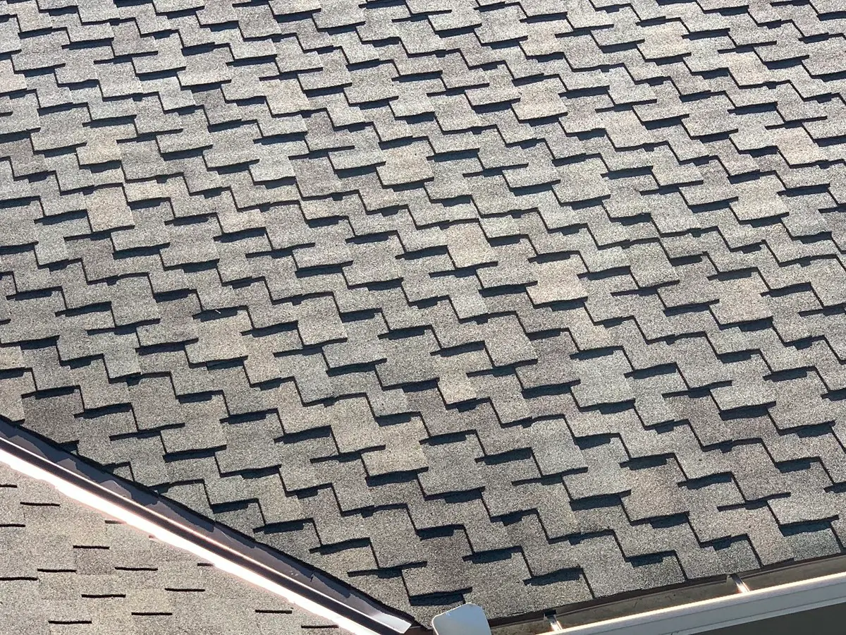 Close view of a gray asphalt-shingle roof field
